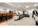 Finished basement with bar area, media console, and comfortable sectional seating at 2805 S Sherman St, Englewood, CO 80113