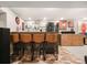 Finished basement bar area with brick floors, seating, and decorative artwork at 2805 S Sherman St, Englewood, CO 80113