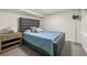Cozy bedroom with padded headboard, blue bedding, and stylish side table at 2805 S Sherman St, Englewood, CO 80113