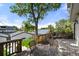 Large wooden deck featuring outdoor furniture, a fire pit, and scenic backyard views at 2805 S Sherman St, Englewood, CO 80113