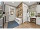 Inviting entryway with custom wood accent wall, bench, and convenient built-in desk nook at 2805 S Sherman St, Englewood, CO 80113