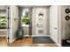 Welcoming foyer with wood floors, stylish decor, a frosted front door, and ample natural light at 2805 S Sherman St, Englewood, CO 80113