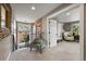 Open hallway leading to sitting room, features carpet, custom wood and decorative mirror at 2805 S Sherman St, Englewood, CO 80113