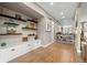 Hallway boasts hardwood floors, custom built-ins, floating shelves, and sliding barn doors at 2805 S Sherman St, Englewood, CO 80113