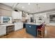 Spacious kitchen featuring a large island with seating, modern appliances, and ample cabinet space at 2805 S Sherman St, Englewood, CO 80113