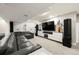 Finished basement with large TV, speakers, sectional seating, and ambient lighting at 2805 S Sherman St, Englewood, CO 80113