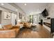 Cozy living room featuring stylish decor, hardwood floors, and a modern fireplace at 2805 S Sherman St, Englewood, CO 80113
