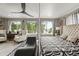 Relaxing bedroom features a chaise lounge, patterned rug, and great natural light at 2805 S Sherman St, Englewood, CO 80113
