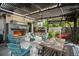 Inviting outdoor patio featuring a stone fireplace, a covered pergola, and stylish seating arrangement at 2805 S Sherman St, Englewood, CO 80113