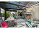 Covered patio with stone fireplace, ceiling fan, and outdoor seating at 2805 S Sherman St, Englewood, CO 80113