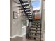 Contemporary staircase features hardwood treads, and sleek metal railing at 2805 S Sherman St, Englewood, CO 80113