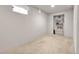 Finished basement room with carpeted floor and a closet at 5100 Troy St, Denver, CO 80239