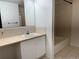 Functional bathroom featuring a vanity sink, ample counter space, and a bathtub at 7755 E Quincy Ave # 203A6, Denver, CO 80237