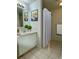 Bright bathroom featuring vanity, mirror, and a shower with a curtain at 7755 E Quincy Ave # 203A6, Denver, CO 80237