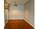 Empty dining area with hardwood floors and a light fixture, ready for personalization at 7755 E Quincy Ave # 203A6, Denver, CO 80237