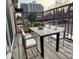 Outdoor patio with a modern table and chairs, perfect for enjoying the view at 7755 E Quincy Ave # 203A6, Denver, CO 80237