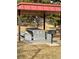 Community picnic area featuring a stone table and benches with a charcoal grill at 7755 E Quincy Ave # 203A6, Denver, CO 80237