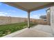 A covered patio featuring sturdy support columns, a small yard and a block fence for outdoor enjoyment at 16369 Alberta Dr, Parker, CO 80134