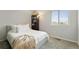 Bright bedroom with a bookcase and a plush bed at 16369 Alberta Dr, Parker, CO 80134