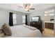 Spacious bedroom featuring a ceiling fan and ensuite bathroom at 16369 Alberta Dr, Parker, CO 80134