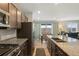Beautiful kitchen with stainless appliances, granite countertops, and an open layout perfect for entertaining at 16369 Alberta Dr, Parker, CO 80134