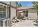Cozy backyard patio area with seating, a red umbrella, and well-maintained surroundings at 6792 E Briarwood Dr, Centennial, CO 80112