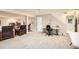 Large basement area with carpeted floors and versatile layout for living and office space at 6792 E Briarwood Dr, Centennial, CO 80112