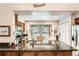 Bright kitchen featuring granite counters, stainless steel appliances and a view to the green outdoors at 6792 E Briarwood Dr, Centennial, CO 80112