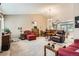 Open-concept living room boasts vaulted ceilings, comfortable seating, and an adjacent dining area for seamless entertaining at 6792 E Briarwood Dr, Centennial, CO 80112