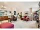 Spacious and inviting living room with comfortable seating, tasteful decor, and ample natural light at 6792 E Briarwood Dr, Centennial, CO 80112