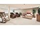 Spacious living room with neutral carpet, comfortable seating, and natural light at 6792 E Briarwood Dr, Centennial, CO 80112