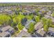 Beautiful aerial view of the neighborhood showcases the lush landscaping and community park at 7870 Sunflower Green # 151, Frederick, CO 80530