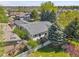 Back aerial view of house showcases roof, yard, and proximity to neighborhood at 7870 Sunflower Green # 151, Frederick, CO 80530