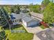 Aerial view of home with a well-maintained lawn, gray roof, and attached two-car garage at 7870 Sunflower Green # 151, Frederick, CO 80530