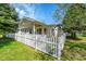 Charming backyard patio enclosed by a white picket fence, perfect for outdoor enjoyment at 7870 Sunflower Green # 151, Frederick, CO 80530