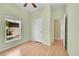 Bedroom with hardwood floors, ceiling fan, window, and doorway at 7870 Sunflower Green # 151, Frederick, CO 80530