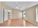 Bedroom with hardwood floors, natural light, neutral paint and door leading to kitchen at 7870 Sunflower Green # 151, Frederick, CO 80530