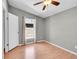 Simple bedroom with grey walls and a hardwood floor at 7870 Sunflower Green # 151, Frederick, CO 80530