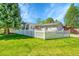 Lovely home with a bright green lawn, a welcoming white picket fence, and mature trees at 7870 Sunflower Green # 151, Frederick, CO 80530