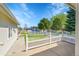 Inviting front yard with a charming white picket fence and well-maintained landscaping at 7870 Sunflower Green # 151, Frederick, CO 80530