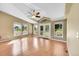 Living room with vaulted ceiling, ceiling fan and access to back patio at 7870 Sunflower Green # 151, Frederick, CO 80530