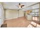 Open floor plan with hardwood floors connecting the kitchen and living room at 7870 Sunflower Green # 151, Frederick, CO 80530