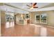 Open floor plan with hardwood floors connecting the kitchen and living room at 7870 Sunflower Green # 151, Frederick, CO 80530