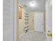 Bright mud room with tile flooring, storage shelves and coat hooks near the door at 7870 Sunflower Green # 151, Frederick, CO 80530