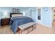 Comfortable bedroom with modern furniture, a large bed, and ample natural light at 4801 E 9Th Ave # 209S, Denver, CO 80220