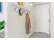 Clean and organized entryway with a coat rack and plenty of space at 4801 E 9Th Ave # 209S, Denver, CO 80220
