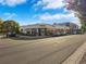 Corner view of Chook Charcoal Chicken restaurant with outdoor seating and street parking, in a commercial area at 4801 E 9Th Ave # 209S, Denver, CO 80220