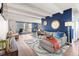 Bright living room features modern decor, hardwood floors, a balcony and abundant natural light at 4801 E 9Th Ave # 209S, Denver, CO 80220