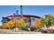 View of Ball Arena exterior, featuring the modern architecture and surrounding greenery at 100 Dudley St, Lakewood, CO 80226