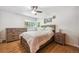 Comfortable bedroom with a large window, hardwood floors, and traditional furnishings at 100 Dudley St, Lakewood, CO 80226